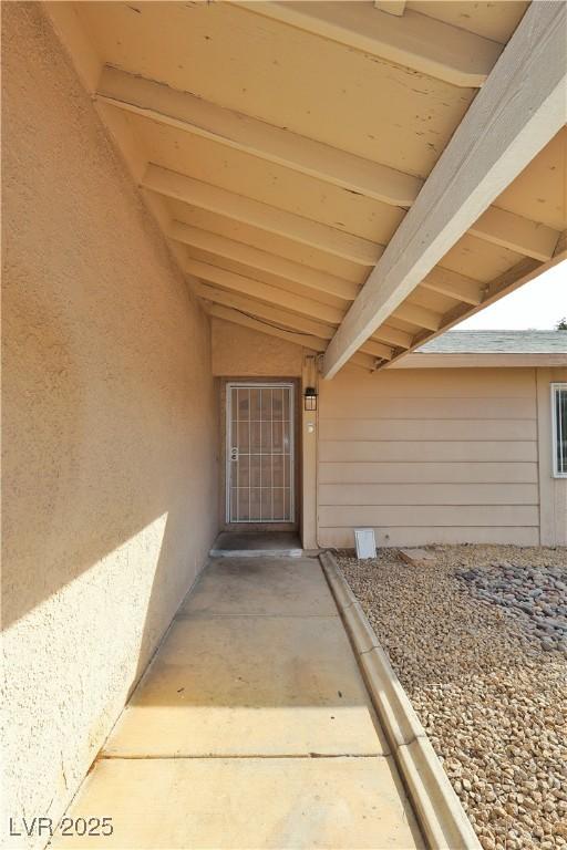 doorway to property with a patio area