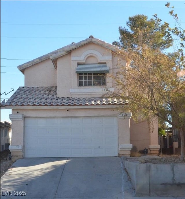 view of front of property with a garage