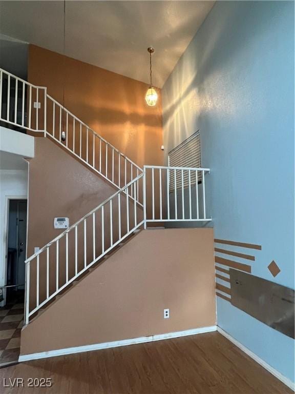 stairs with hardwood / wood-style floors