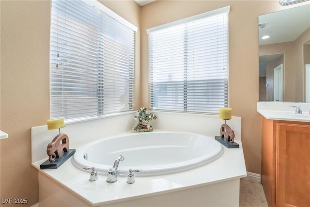 bathroom with vanity and a bathing tub