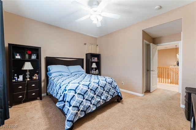 bedroom with ceiling fan and light carpet