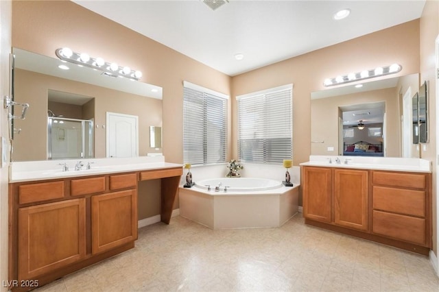 bathroom with plus walk in shower and vanity