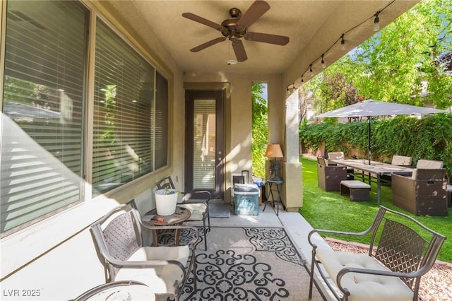 view of patio / terrace with ceiling fan and outdoor lounge area