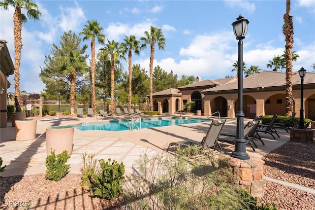 view of swimming pool featuring a patio area