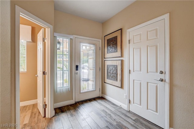 doorway to outside featuring light hardwood / wood-style flooring