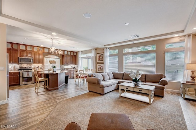 living room with light hardwood / wood-style floors