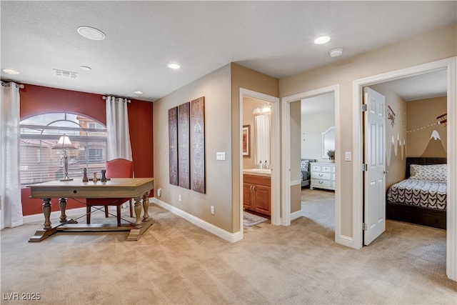 office with sink and light colored carpet