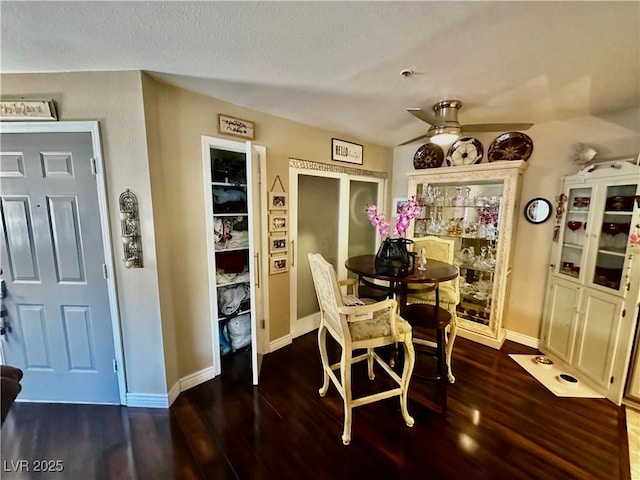 dining room with wood-type flooring and ceiling fan