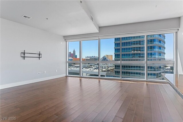 empty room featuring hardwood / wood-style flooring