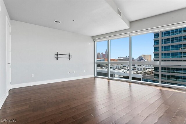 spare room with hardwood / wood-style floors