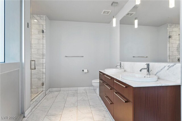 bathroom featuring toilet, walk in shower, and vanity