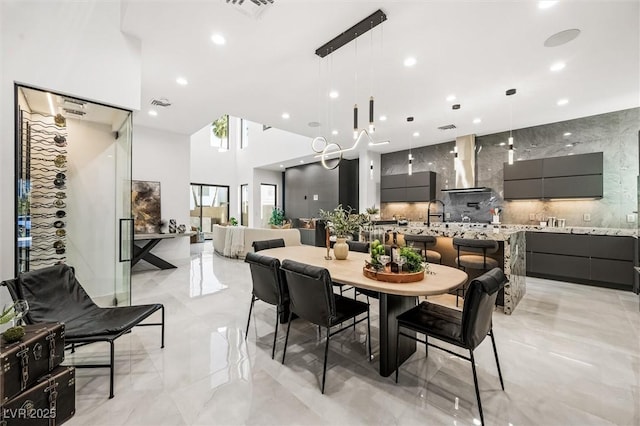 dining space with a high ceiling