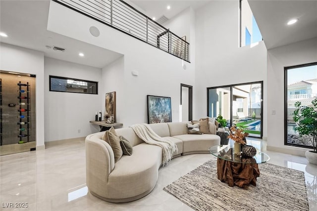 living room featuring a high ceiling