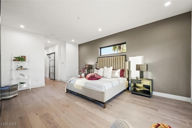 bedroom with light hardwood / wood-style flooring