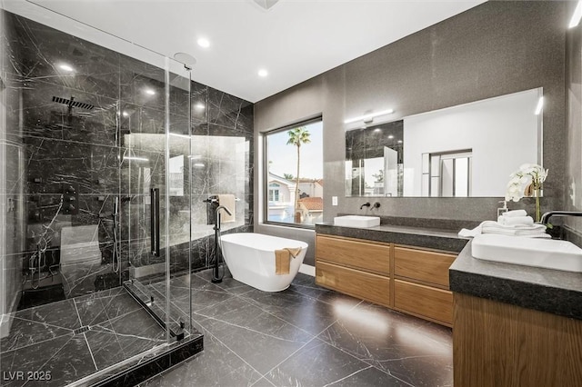 bathroom featuring separate shower and tub and vanity