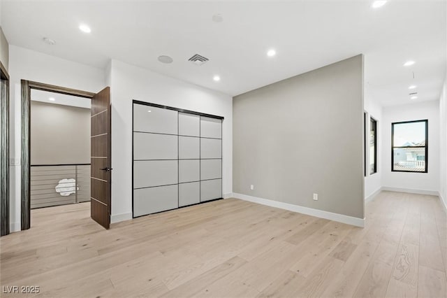 unfurnished bedroom featuring light hardwood / wood-style flooring