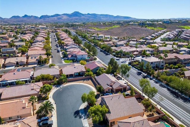 birds eye view of property with a mountain view