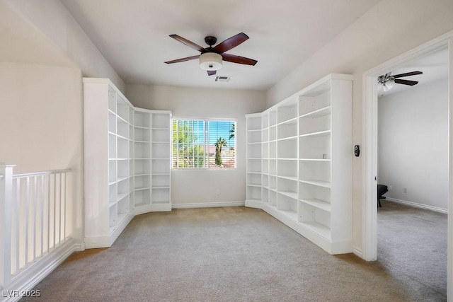 carpeted empty room with ceiling fan