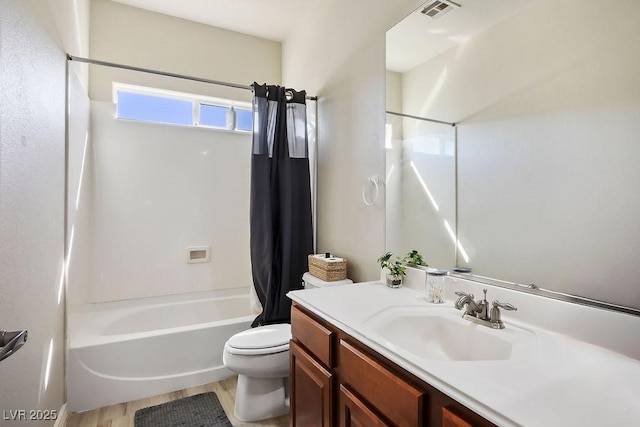 full bathroom featuring shower / tub combo, toilet, vanity, and wood-type flooring