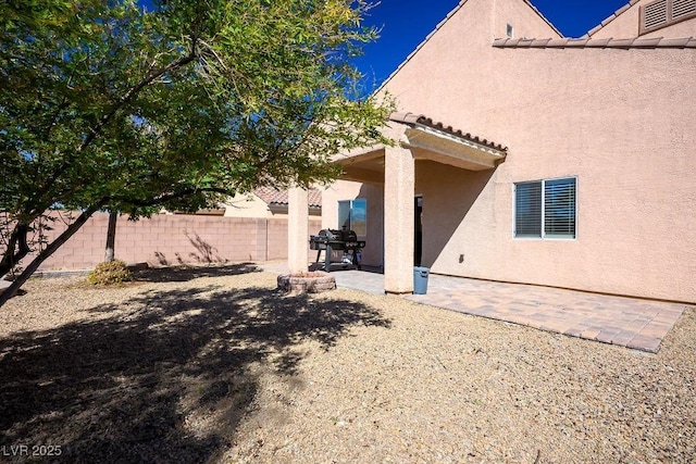 rear view of house with a patio