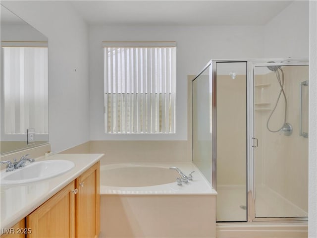 bathroom with shower with separate bathtub and vanity