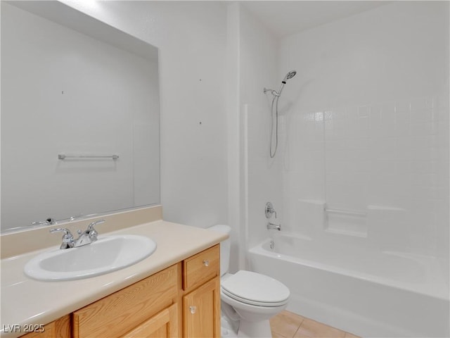 full bathroom featuring toilet, vanity, tile patterned floors, and tub / shower combination