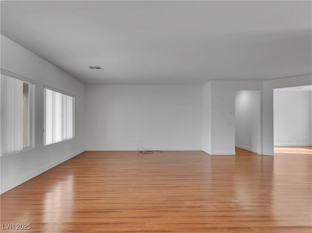 unfurnished room featuring light wood-type flooring