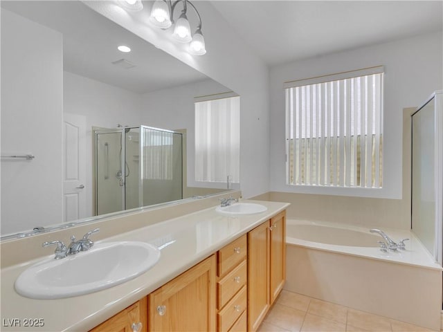 bathroom with vanity, tile patterned flooring, and independent shower and bath