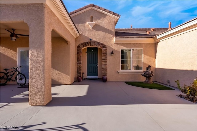 property entrance featuring a patio area