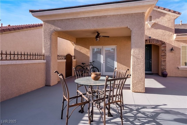 view of patio featuring ceiling fan