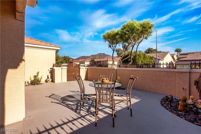 view of patio / terrace featuring a mountain view