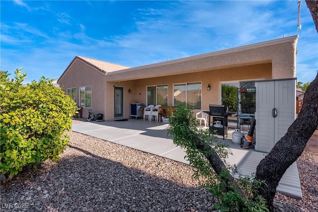 rear view of house featuring a patio area