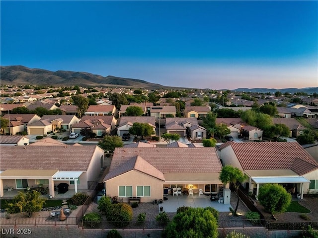 aerial view at dusk with a mountain view