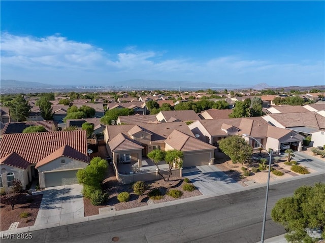 birds eye view of property with a mountain view