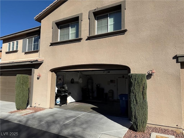 view of side of property featuring a garage