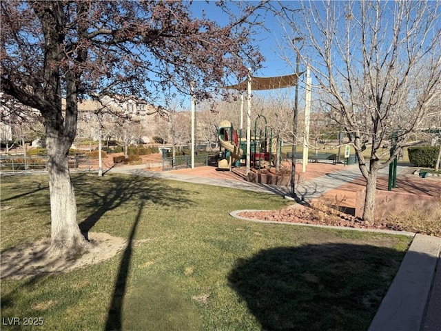 view of property's community with a lawn and a playground