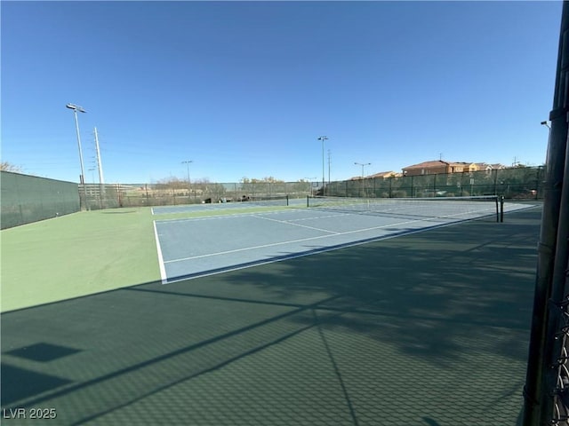 view of sport court with basketball hoop