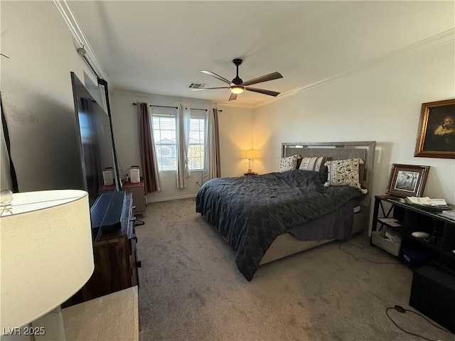 carpeted bedroom with ceiling fan and crown molding