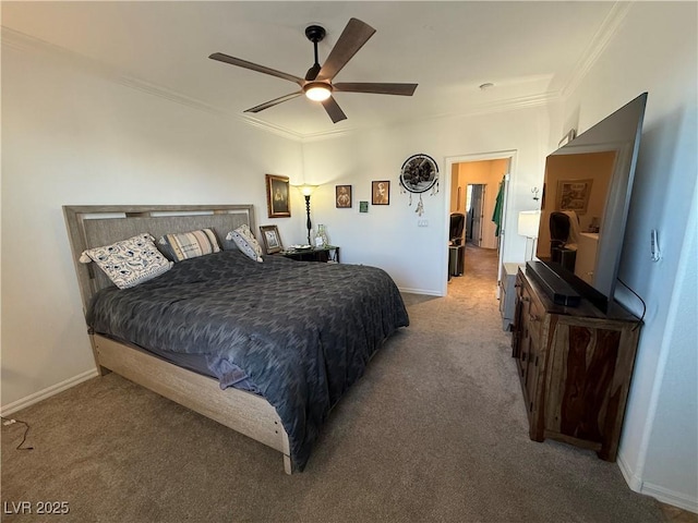 bedroom featuring ceiling fan, crown molding, and carpet flooring