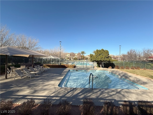 view of swimming pool with a patio area