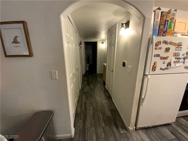 hallway featuring dark hardwood / wood-style floors