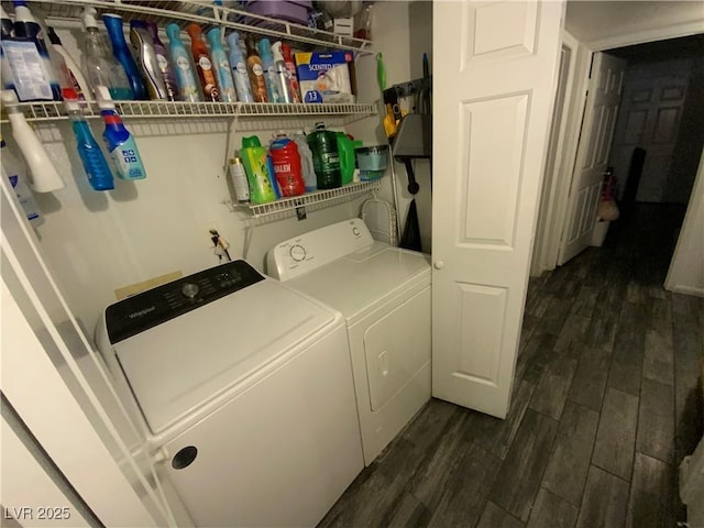 washroom with dark wood-type flooring and washing machine and dryer