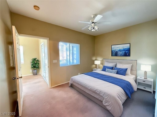 bedroom featuring ceiling fan and carpet