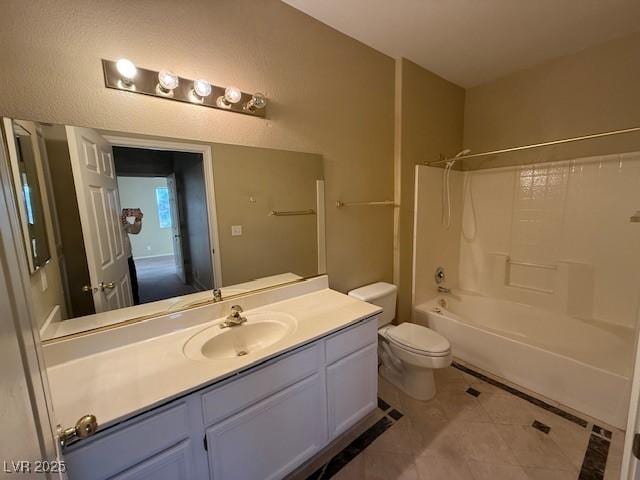 full bathroom with toilet, vanity, tile patterned floors, and washtub / shower combination