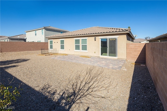 back of house with a patio area