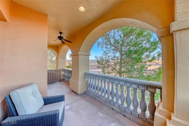 balcony featuring ceiling fan