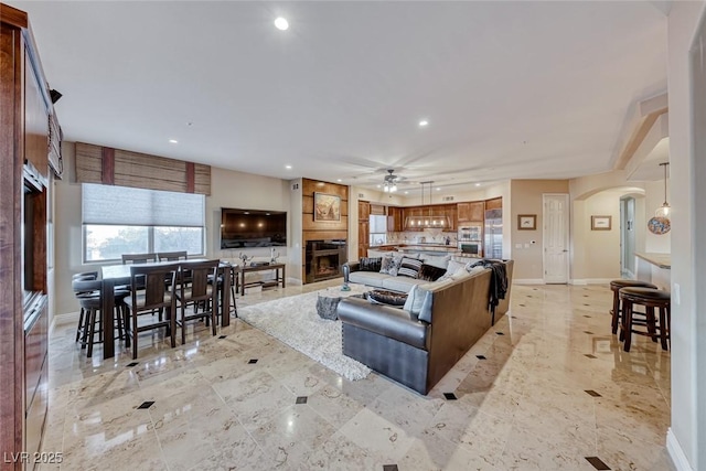 living room featuring ceiling fan