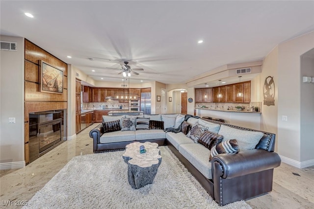 living room featuring ceiling fan