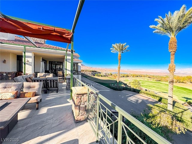 view of patio / terrace featuring an outdoor hangout area and a mountain view