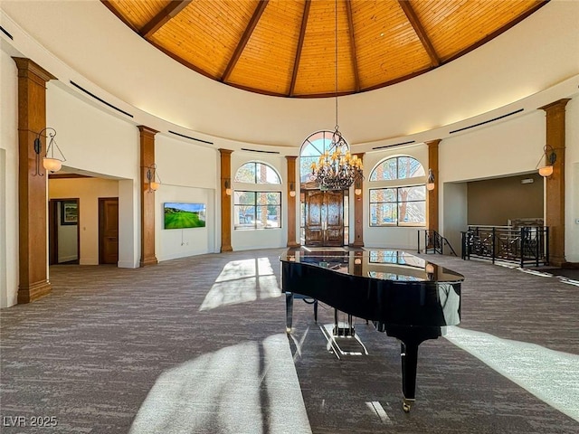 misc room featuring beamed ceiling, high vaulted ceiling, wooden ceiling, and an inviting chandelier